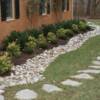 Rock drain,stepping stones and shrubs installed